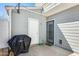 Private patio area featuring a grill, and a light gray door and wall at 1600 N Saba St # 177, Chandler, AZ 85225