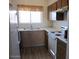 Functional kitchen featuring essential appliances, ample counter space, and warm wood cabinetry at 16528 E Gunsight Dr # 206, Fountain Hills, AZ 85268