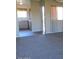 Open-concept living space with neutral carpet, creating a flexible and inviting area for relaxation and entertainment at 16528 E Gunsight Dr # 206, Fountain Hills, AZ 85268