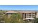 Multi-story building with a serene mountain backdrop, showing landscaping at 16528 E Gunsight Dr # 206, Fountain Hills, AZ 85268