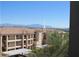 Exterior view of a multi-story building with a serene mountain backdrop at 16528 E Gunsight Dr # 206, Fountain Hills, AZ 85268
