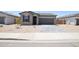 Charming single-story home with gray stucco and a well-manicured, xeriscaped front yard at 1661 N St Francis Pl, Casa Grande, AZ 85122