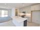 Bright, modern kitchen with white cabinetry, a large island, and stainless steel appliances at 1661 N St Francis Pl, Casa Grande, AZ 85122