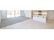 Open floor plan showcasing the modern kitchen with white countertops and a connected living space at 1661 N St Francis Pl, Casa Grande, AZ 85122