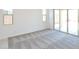 Bright living room with large windows and sliding glass doors leading to the outdoor area at 1661 N St Francis Pl, Casa Grande, AZ 85122