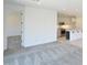 Open floor plan with living space adjacent to the kitchen with modern stainless appliances at 1661 N St Francis Pl, Casa Grande, AZ 85122