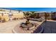 Serene backyard featuring a decorative fountain, swing, and lush landscaping at 17574 W Gelding Dr, Surprise, AZ 85388