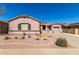 Charming single-story home with desert landscaping and a two-car garage at 17574 W Gelding Dr, Surprise, AZ 85388
