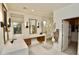 Elegant bathroom with double vanity, modern lighting and a glass-enclosed shower at 17594 N 98Th Way, Scottsdale, AZ 85255