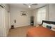 This bedroom offers a ceiling fan, plantation shutters and a spacious closet at 17594 N 98Th Way, Scottsdale, AZ 85255