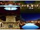 Nighttime view of a community pool, fountain, and fireplace with stone mantel at 17594 N 98Th Way, Scottsdale, AZ 85255
