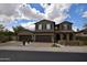 Inviting two-story home boasting a three-car garage and desert landscaping at 17594 N 98Th Way, Scottsdale, AZ 85255