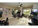 Well-equipped home gym with modern exercise equipment, mirrored walls, and natural light from large windows at 17594 N 98Th Way, Scottsdale, AZ 85255