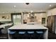 Bright kitchen with a large island, stainless steel appliances, and an open layout at 17594 N 98Th Way, Scottsdale, AZ 85255