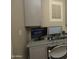 This home office features a corner desk, two computer monitors and built-in storage at 17594 N 98Th Way, Scottsdale, AZ 85255