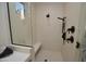 Modern shower with sleek black fixtures, a built-in bench and neutral tile at 17594 N 98Th Way, Scottsdale, AZ 85255