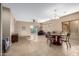 Expansive living area with tile flooring, plenty of natural light, and an adjacent dining space at 18081 W Tasha Dr, Surprise, AZ 85388