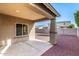 Covered patio with concrete floor overlooks a gravel backyard at 18081 W Tasha Dr, Surprise, AZ 85388