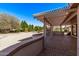 A covered patio and desert landscaping create an inviting backyard space at 18155 N Sterling Dr, Surprise, AZ 85374