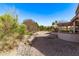 Landscaped backyard featuring desert plants and rock ground cover for easy maintenance at 18155 N Sterling Dr, Surprise, AZ 85374