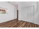 Bedroom with wood-look floors and a large sliding-door closet at 18155 N Sterling Dr, Surprise, AZ 85374