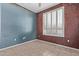 Neutral bedroom with a large window and two-tone walls at 18155 N Sterling Dr, Surprise, AZ 85374