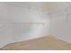 Empty walk-in closet with wire shelving and neutral carpet at 18155 N Sterling Dr, Surprise, AZ 85374