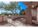 Inviting desert home featuring a front patio, desert landscaping, and a neutral color palette at 18155 N Sterling Dr, Surprise, AZ 85374