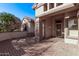 Charming desert home with a front porch, desert landscaping, and a neutral color palette, creating great curb appeal at 18155 N Sterling Dr, Surprise, AZ 85374