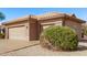 Spacious three-car garage with neutral paint and desert landscaping, offering functionality and curb appeal at 18155 N Sterling Dr, Surprise, AZ 85374