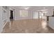 Spacious living room with built-in shelving, and tile flooring at 18155 N Sterling Dr, Surprise, AZ 85374