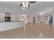 Open-concept living space with tile floors, connecting to the kitchen and other rooms at 18155 N Sterling Dr, Surprise, AZ 85374