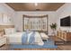 Inviting main bedroom with a bay window, soft blue accents, and comfortable furnishings at 18155 N Sterling Dr, Surprise, AZ 85374