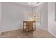 Bonus room with tiled floors, white walls, and a window with plantation shutters at 18155 N Sterling Dr, Surprise, AZ 85374