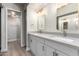 Modern bathroom featuring a double sink vanity with quartz countertops and gold hardware at 1905 E University Dr # 162, Tempe, AZ 85288