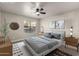 Serene bedroom with a ceiling fan, a large window, and modern decor at 1905 E University Dr # 162, Tempe, AZ 85288