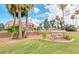 Papago Park Village II community entrance with lush landscaping, palm trees and building view at 1905 E University Dr # 162, Tempe, AZ 85288