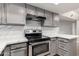 Updated kitchen featuring gray cabinets, stainless steel appliances and quartz countertops at 1905 E University Dr # 162, Tempe, AZ 85288