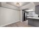 Bright and airy kitchen with gray cabinets, stainless steel appliances, quartz countertops and a skylight at 1905 E University Dr # 162, Tempe, AZ 85288