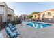 Community pool surrounded by lounge chairs, offering a refreshing oasis for residents at 1905 E University Dr # 162, Tempe, AZ 85288