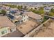 Aerial view of a two-story home with a tile roof, solar panels, and a large backyard at 19937 W Heatherbrae Dr, Litchfield Park, AZ 85340