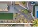 Aerial shot of a landscaped backyard with rocks, bushes and small trees, and a swimming pool next to a patio at 2004 W Kristal Way, Phoenix, AZ 85027