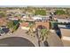 Aerial view of home and neighborhood features desert landscaping and beautiful palm trees at 2004 W Kristal Way, Phoenix, AZ 85027