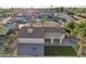 Aerial view of a single-Gathering home with a covered patio, brick patio, small turf patch, desert landscaping and mature palm trees at 2004 W Kristal Way, Phoenix, AZ 85027