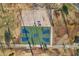Aerial view of a basketball court, set amongst trees, walking paths, and a volleyball court, surrounded by the park at 2004 W Kristal Way, Phoenix, AZ 85027