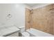 Bathroom with a tub and shower combo featuring tile surround at 2004 W Kristal Way, Phoenix, AZ 85027