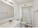 Bathroom features a vanity with quartz countertop and walk-in shower with glass doors at 2004 W Kristal Way, Phoenix, AZ 85027
