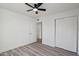 Spacious bedroom with ceiling fan, and featuring a closet and a door leading to another room at 2004 W Kristal Way, Phoenix, AZ 85027