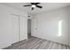 Bedroom with ceiling fan and closet with doors, providing ample storage space at 2004 W Kristal Way, Phoenix, AZ 85027