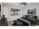 Bedroom showcasing natural light, wood-look flooring, and view of the patio at 2004 W Kristal Way, Phoenix, AZ 85027